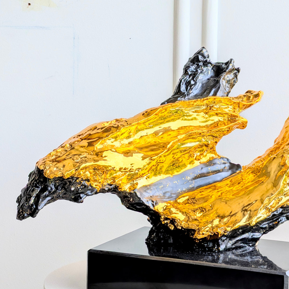 Ignis contrasting black and gold resin sculpture close-up