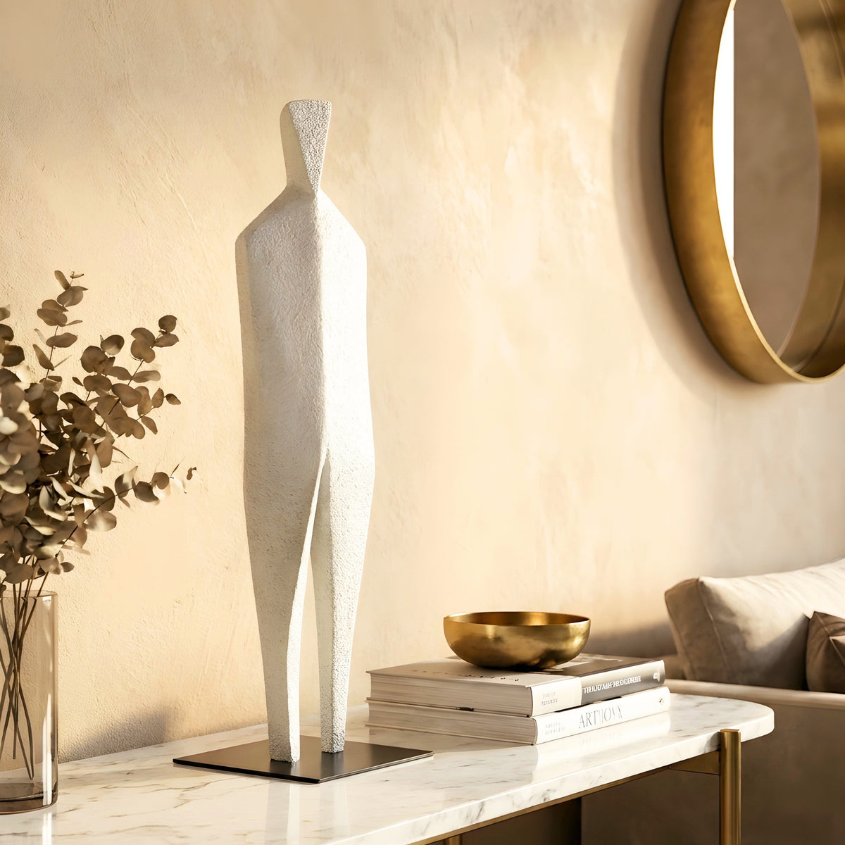 Stature white abstract sculpture styled on a marble sideboard in a warm modern interior