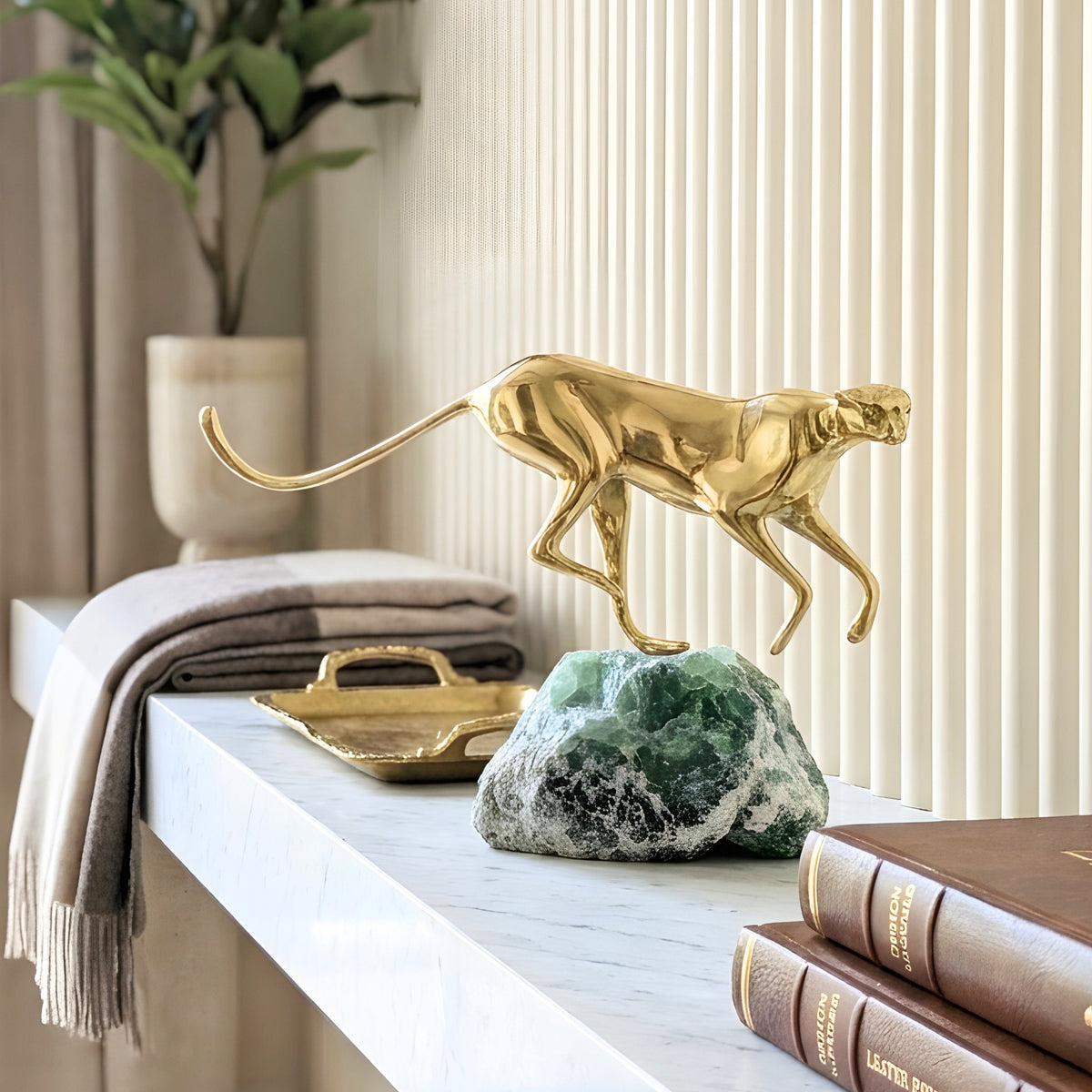 Velocity brass wildlife sculpture on green natural stone for luxury living room and console styling, view 7