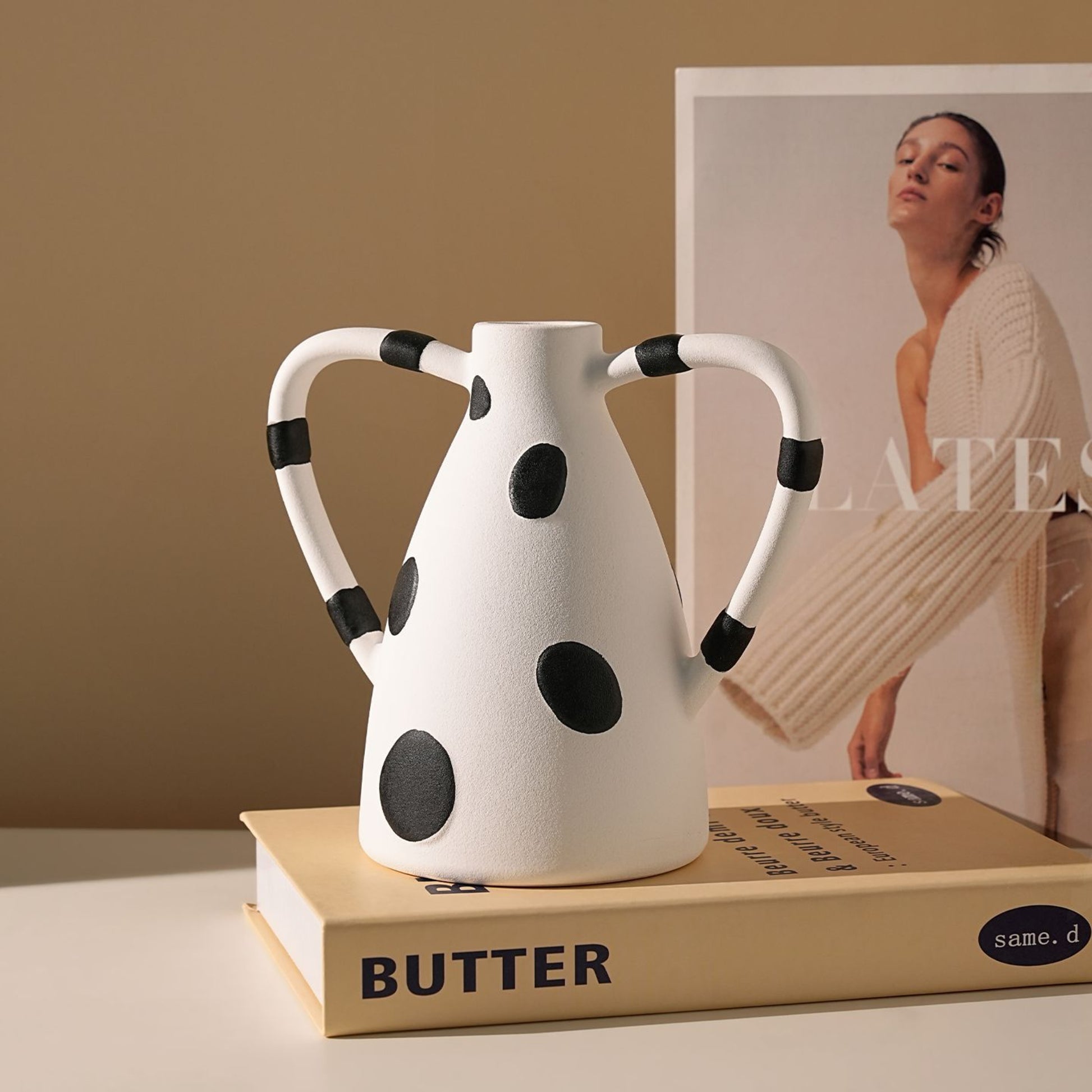 Geometrica black-polka-dot ceramic vase styled on books