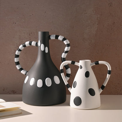 Geometrica polka-dot ceramic vases styled on a console
