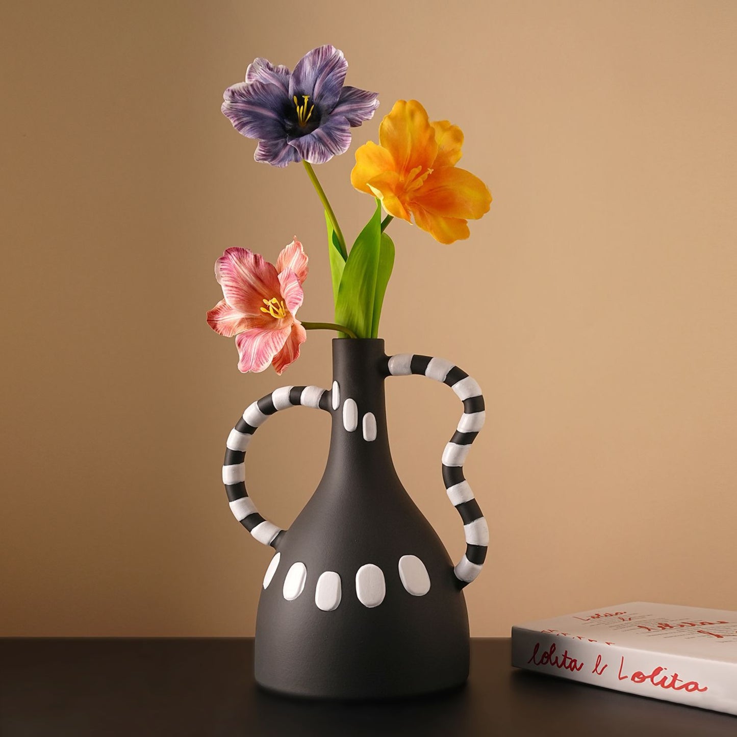 Geometrica black ceramic vase with white dots styled with flowers