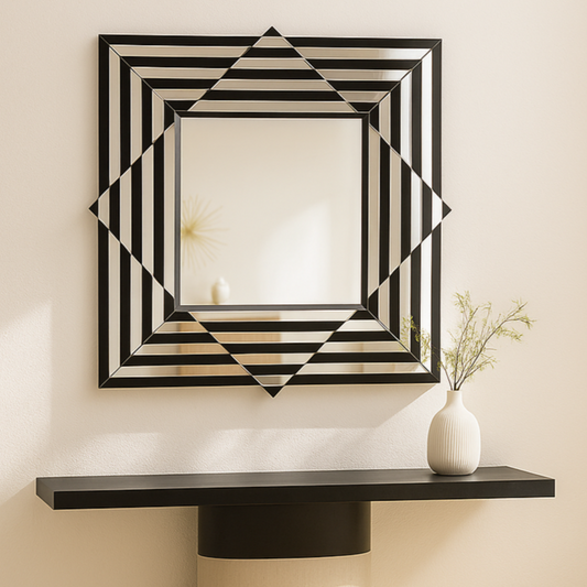 Decorative wall mirror with geometric pattern on a wall above a console table.