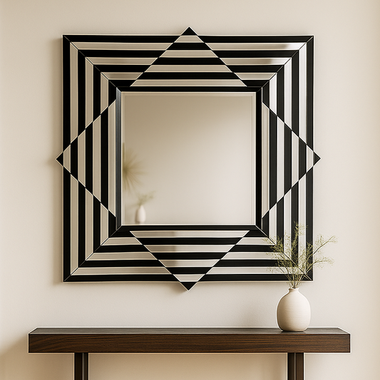 Decorative wall mirror with geometric design on a wall above a wooden console table.
