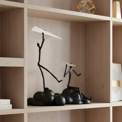 Daydreamer - Human Figurine Sitting on Cloud with Paper Plane