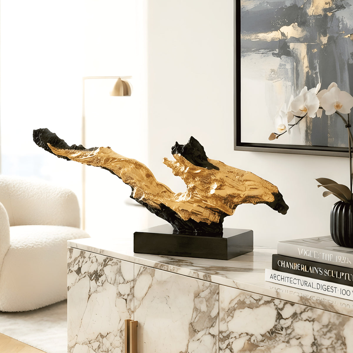 Ignis black and gold statement showpiece styled on a living room marble sideboard