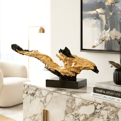 Ignis black and gold statement showpiece styled on a living room marble sideboard