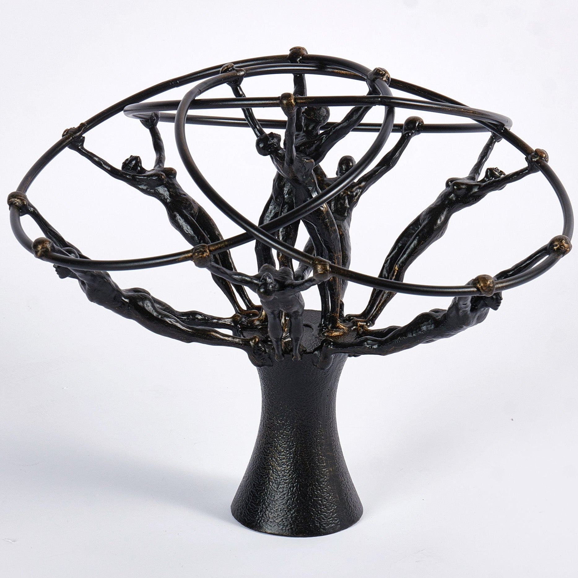 Black metal sculpture with circular top and tree-like base on a white background