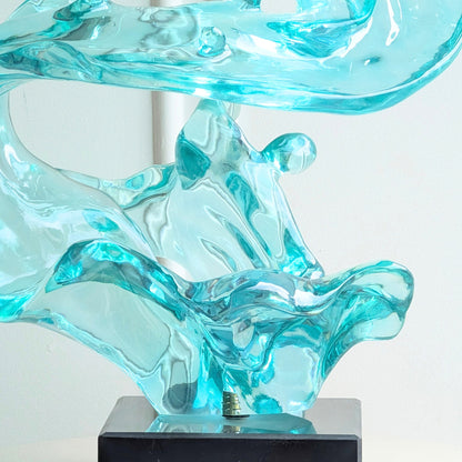 Aqua sculptural resin form and marble base, close-up