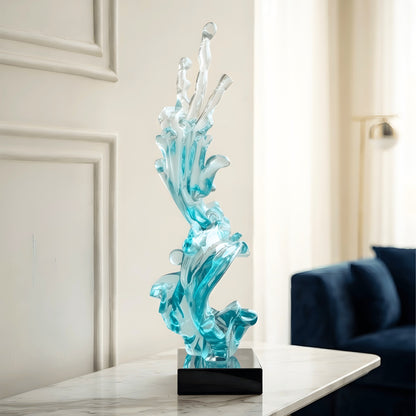 Aqua blue sculpture styled on a marble sideboard