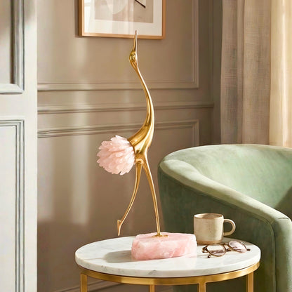 Ardea pink agate and gold-toned metal bird showpiece with upward-reaching neck — styled in a luxury interior