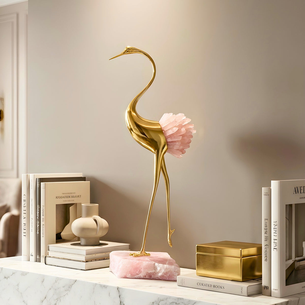 Ardea pink agate and gold-toned metal bird showpiece with curved neck — styled in a luxury interior