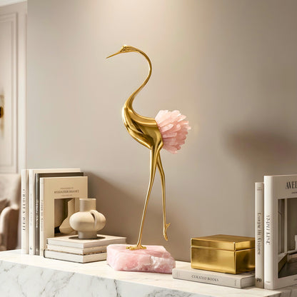 Ardea pink agate and gold-toned metal bird showpiece with curved neck — styled in a luxury interior