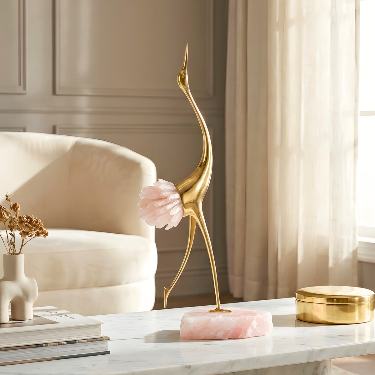 Ardea pink agate and gold-toned metal bird showpiece with upward-reaching neck — styled in a luxury interior