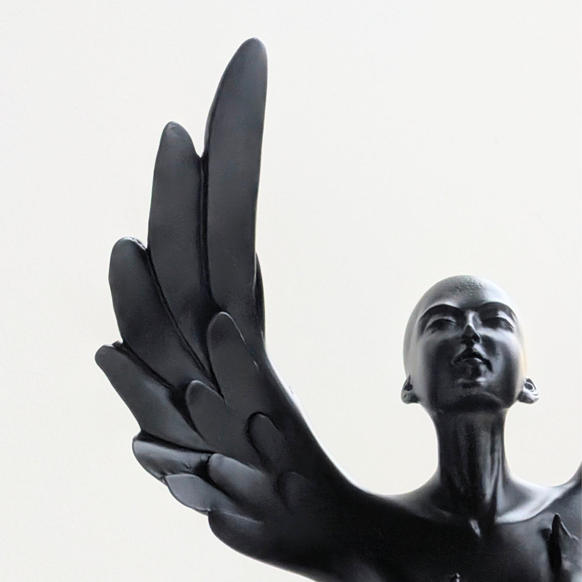 Detailed view of the sculpted wings on the Ascend black resin showpiece