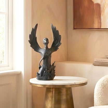 Ascend black resin winged human figurine styled on a marble side table