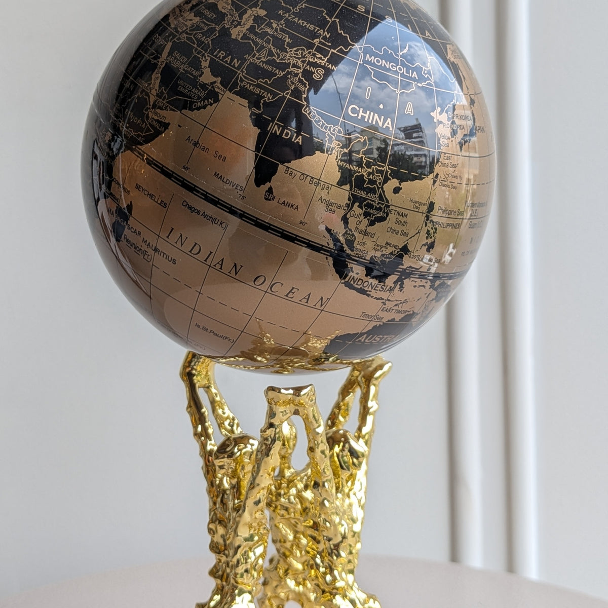 Atlas bronze and black globe showpiece close-up detail