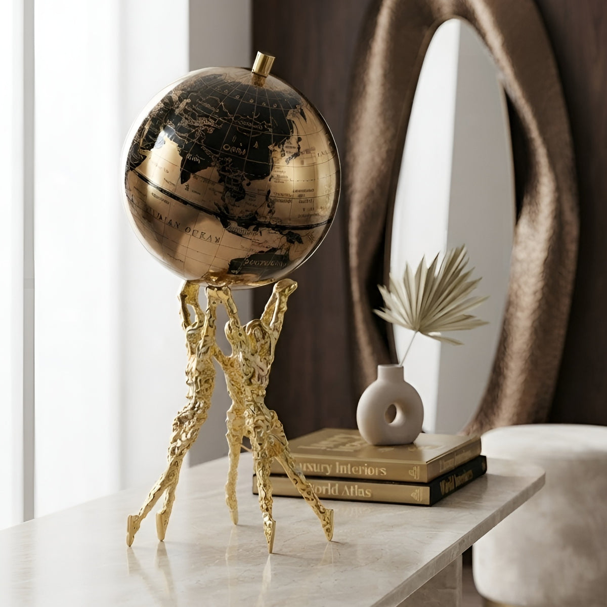 Atlas human figurine globe showpiece styled on a sideboard