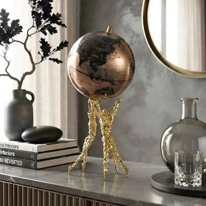 Atlas globe human figurine showpiece styled on a console table