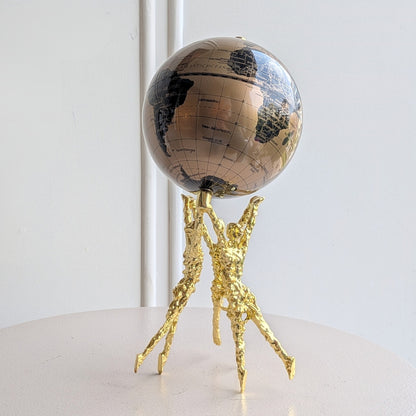 Atlas gold human figurine with bronze and black globe front view