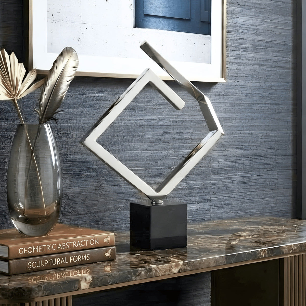 Axiom abstract silver showpiece styled on a dark marble console