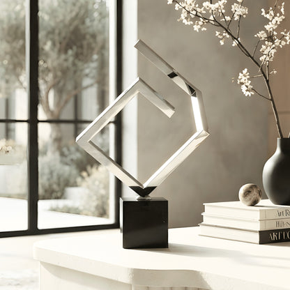 Axiom stainless steel and marble showpiece styled on an entryway console