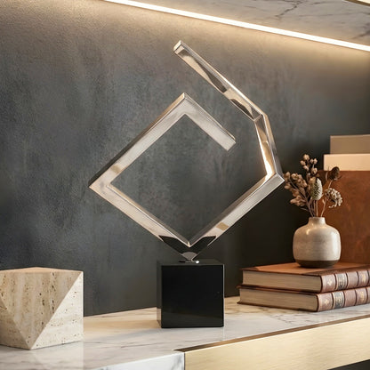Axiom modern geometric sculpture styled on a marble console table