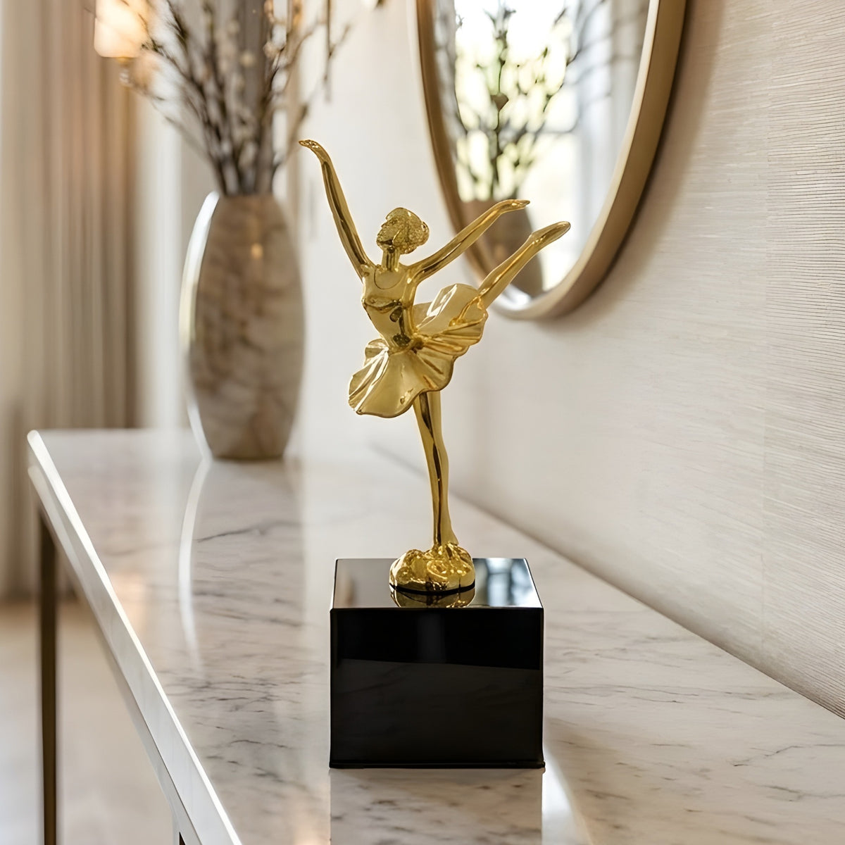Ballet Style 2 gold metal ballerina figurine styled on a console table