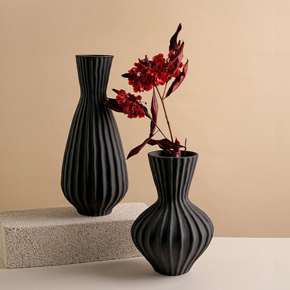 Blackridge matte black ceramic table vases styled with red botanicals