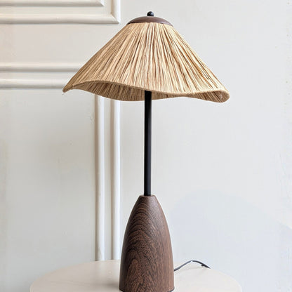 Canopy table lamp product view with warm wood-toned base, black stem and flared shade