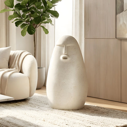 Carven tall white human floor sculpture styled in a contemporary living room
