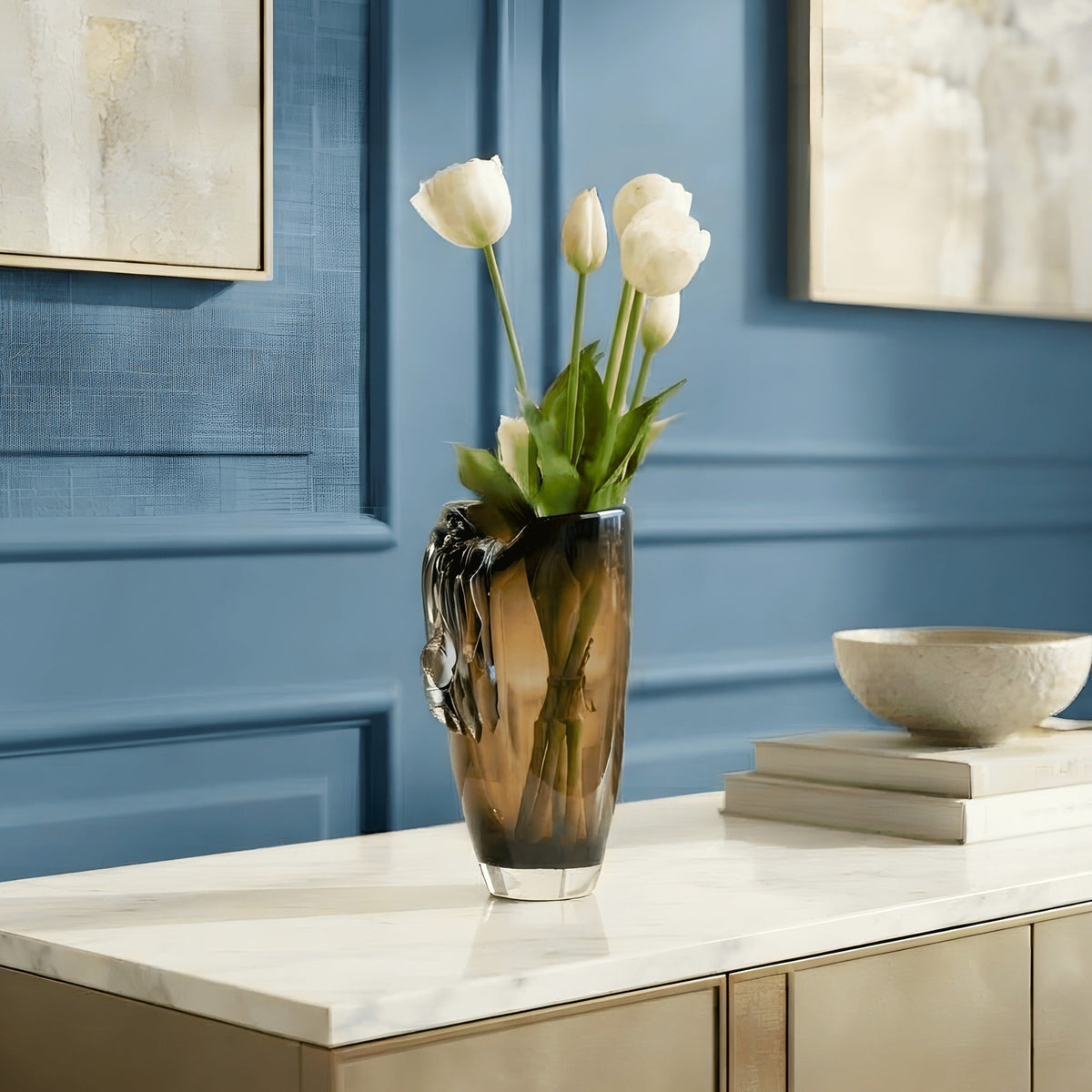 Cascade amber crystal vase styled in a refined blue luxury interior