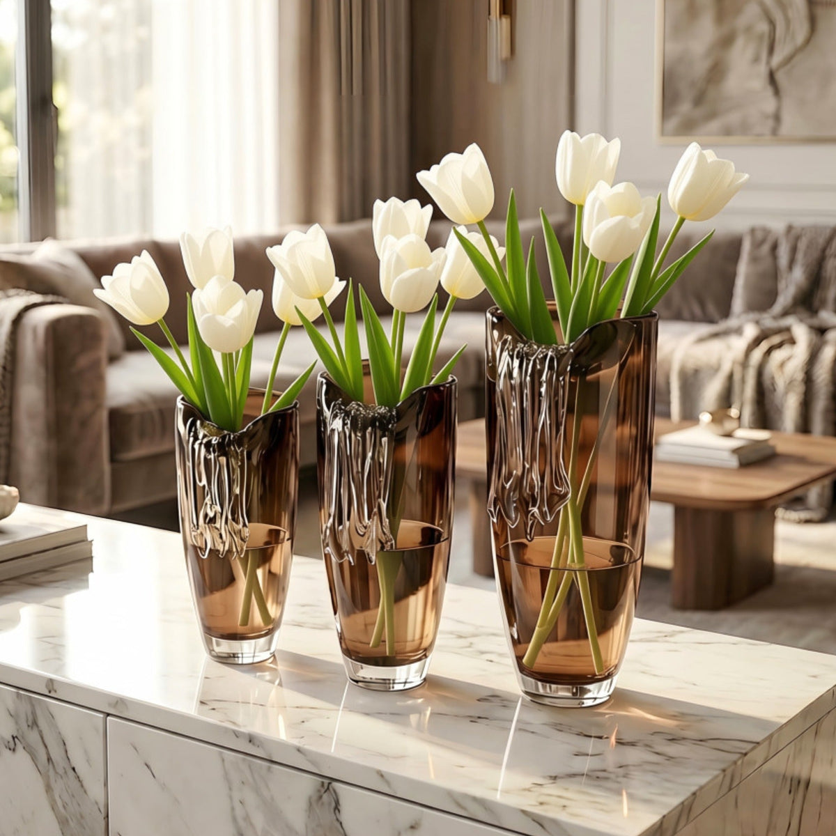 Cascade amber crystal table vases styled with white tulips in a luxury living room