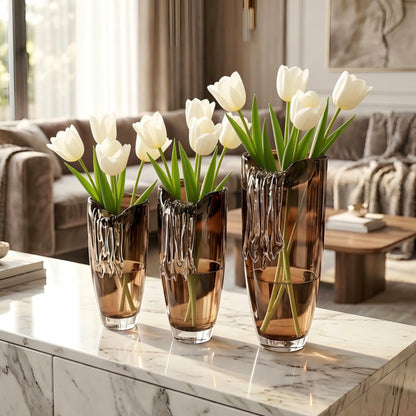Cascade amber crystal table vases styled with white tulips in a luxury living room
