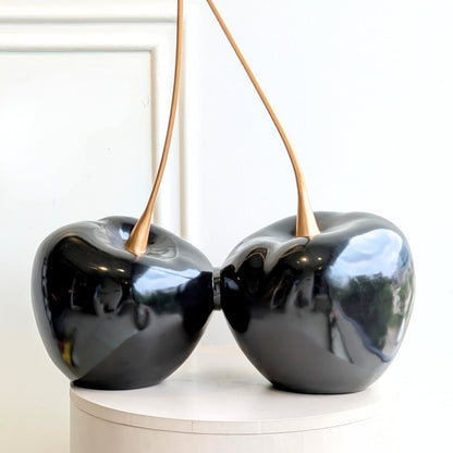 Cherish glossy black resin cherry showpiece with gold metal stems front view