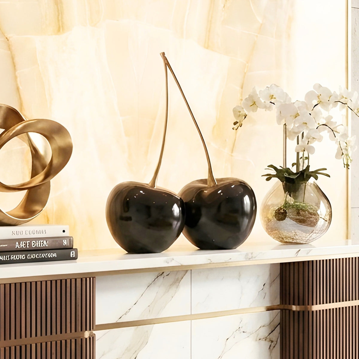 Cherish resin and metal cherry showpiece styled on a marble console with modern decor