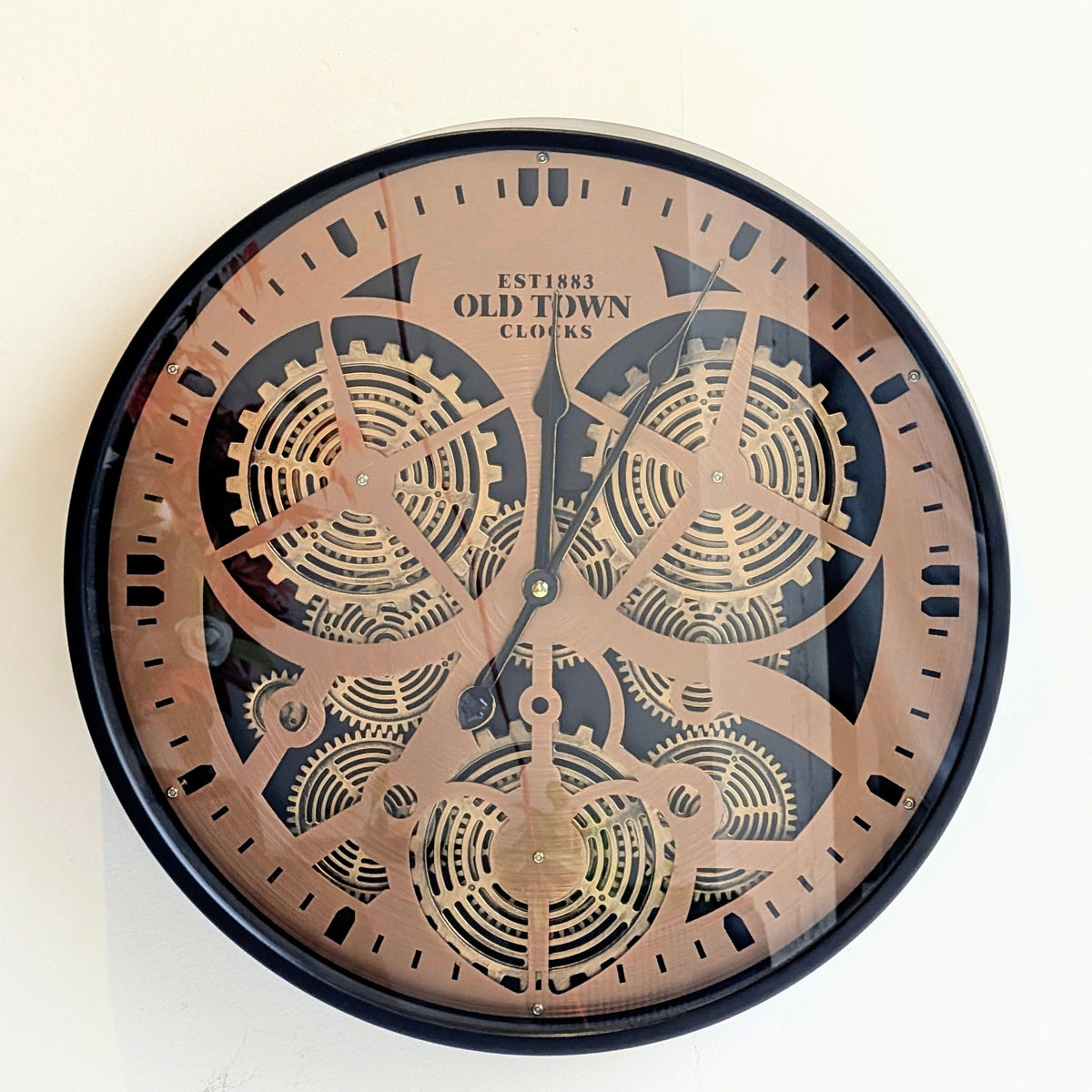 Front view of Chronicle metal and glass vintage gear wall clock