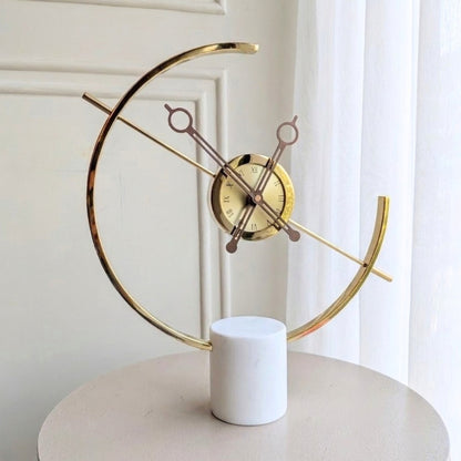 Chronos marble and metal table clock front view on a round table