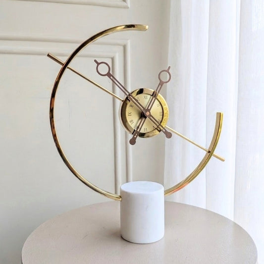 Chronos marble and metal table clock front view on a round table