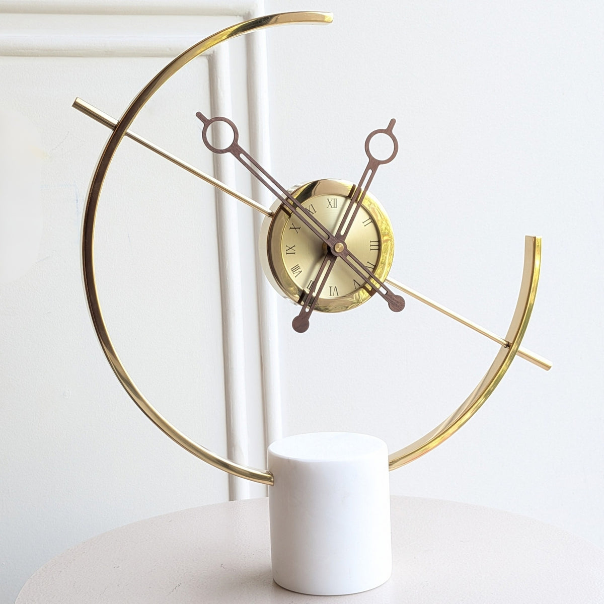 Chronos gold metal and white marble table clock close front view