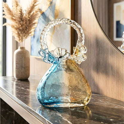 Couture blue-gold crystal handbag showpiece styled on a console