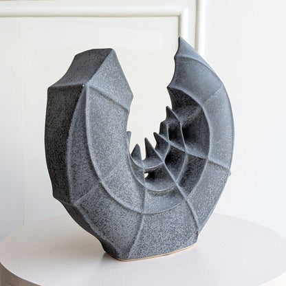 Crescent ceramic vase and showpiece angled studio view