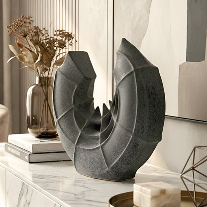 Crescent ceramic vase styled on a modern sideboard