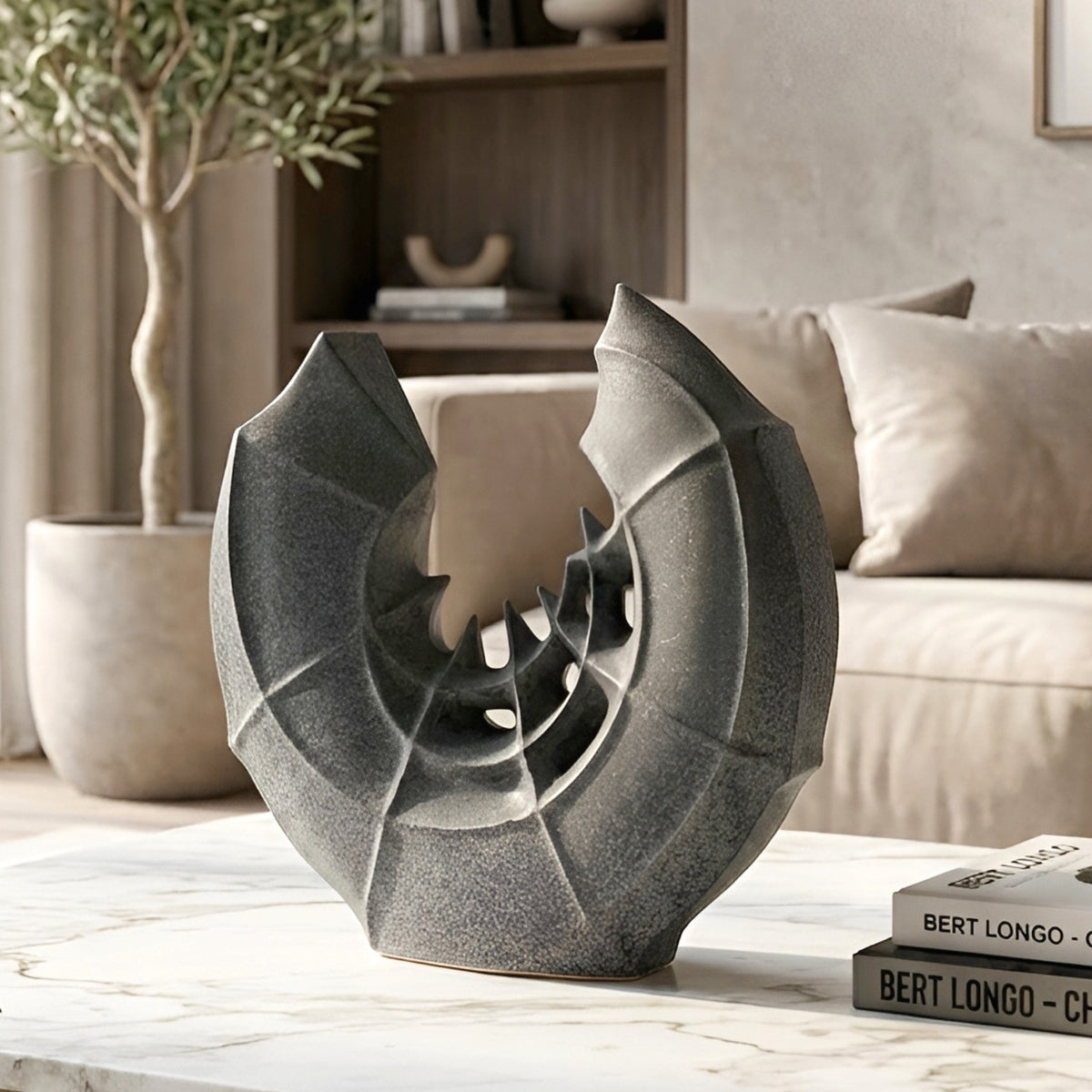 Crescent ceramic sculptural vase styled on a centre table