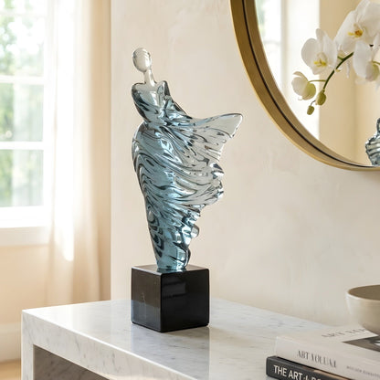 Diva translucent blue dancer showpiece styled on an entryway console beneath a round mirror