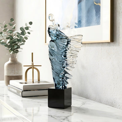 Diva flowing dancer figurine styled on a marble sideboard with books and modern decor