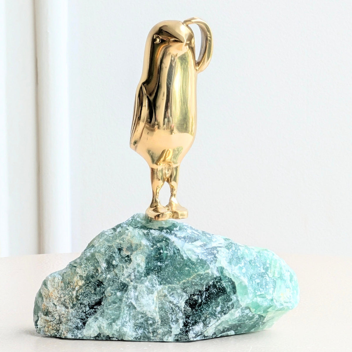 Flippers brass penguin sculptures on green natural stone for luxury console decor, view 8