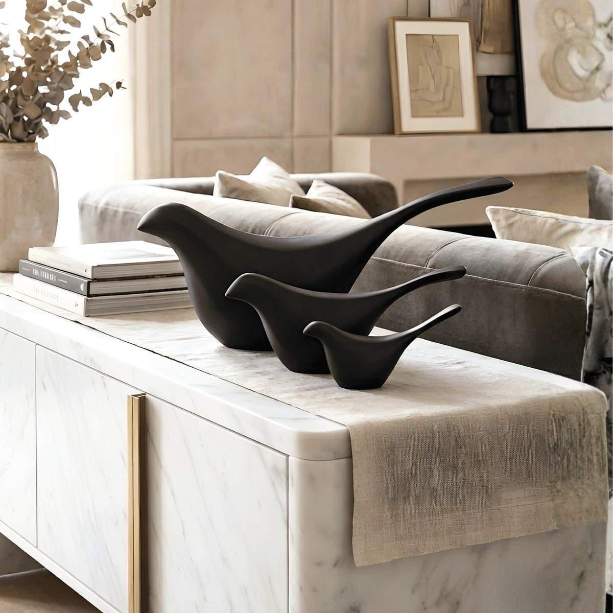 Flock black bird showpieces set of 3 styled on a living room console