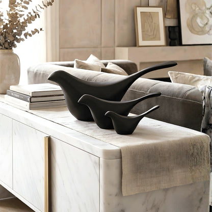 Flock black bird showpieces set of 3 styled on a living room console