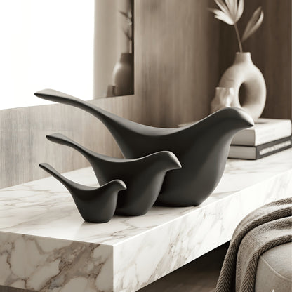 Flock black resin bird showpieces set of 3 styled on a white marble console